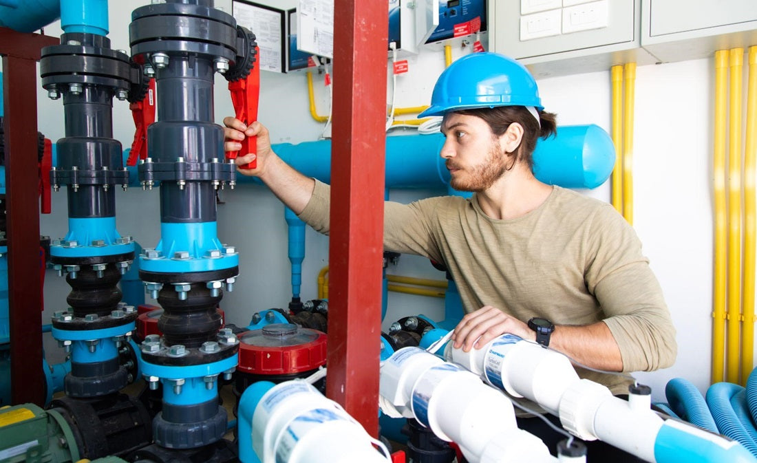 HVAC technician installing a new pool heating pump