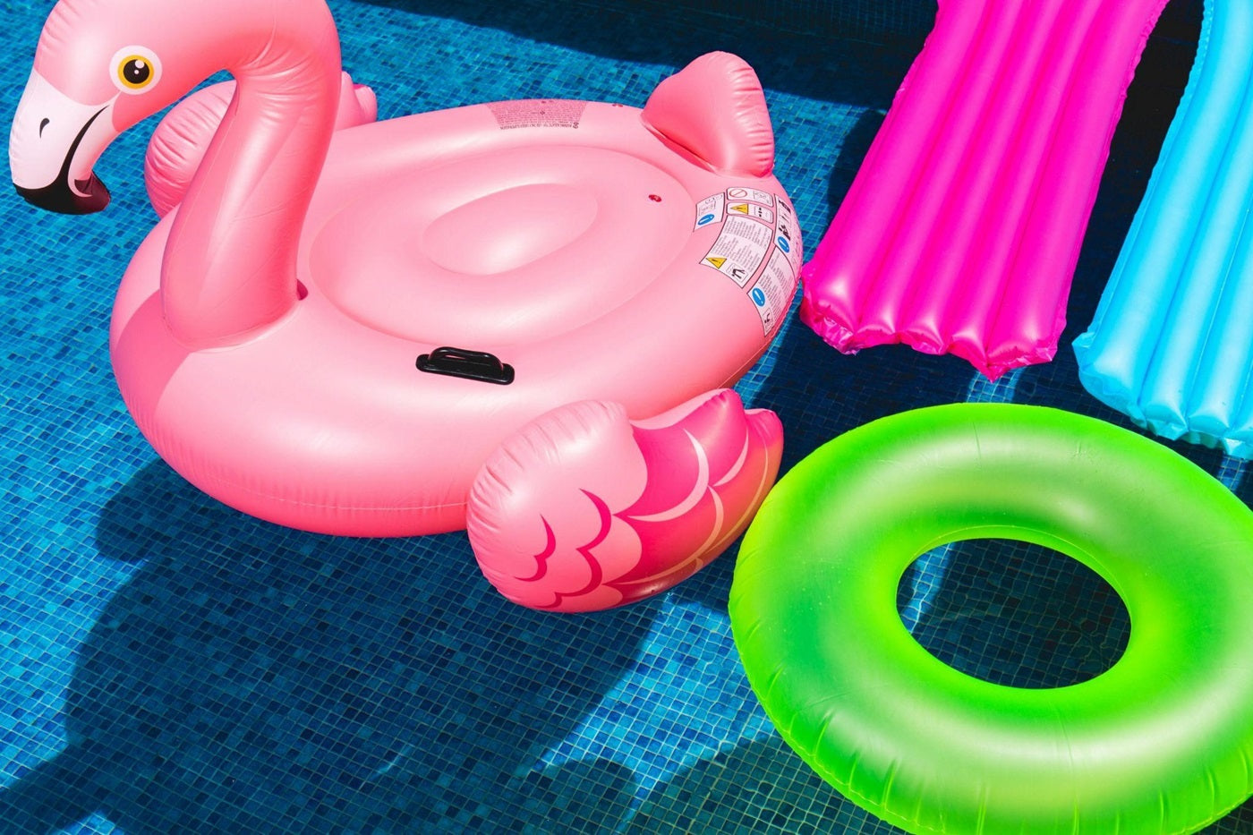 Pool floats in a backyard swimming pool