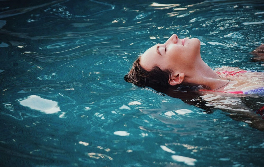 women floating in the swimming pool