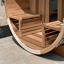 Leisurecraft - Panoramic Sauna with Porch - Knotty Cedar | 7'x8' | Huum Drop 9KW WiFi | Drop Railing | Porch w/Signature Benches | Inside Signature Benches | Door with Large Bronze Window | Black Metal Roof | Electric Sauna Light|